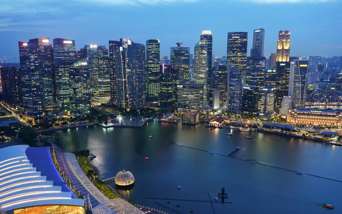 The Singapore financial district and Marina Bay skyline at dusk