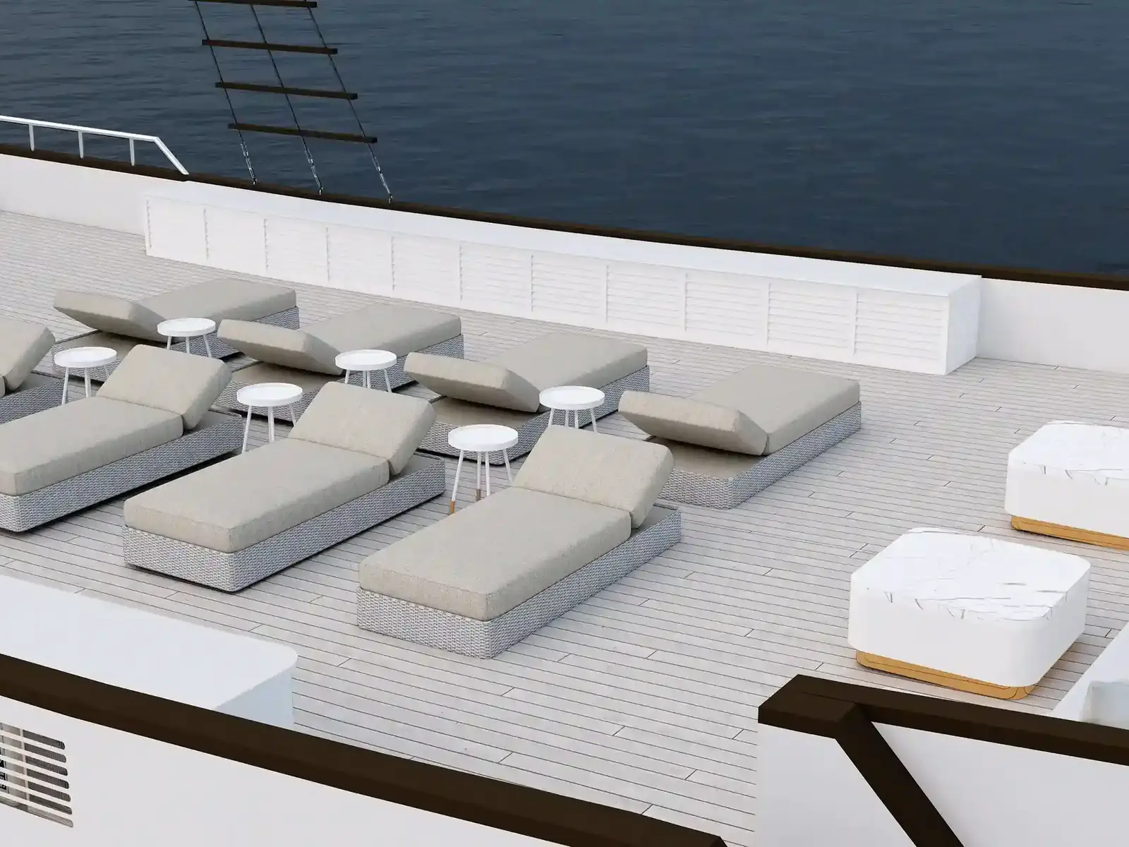 The sundeck of a charter phinisi laid out with loungers