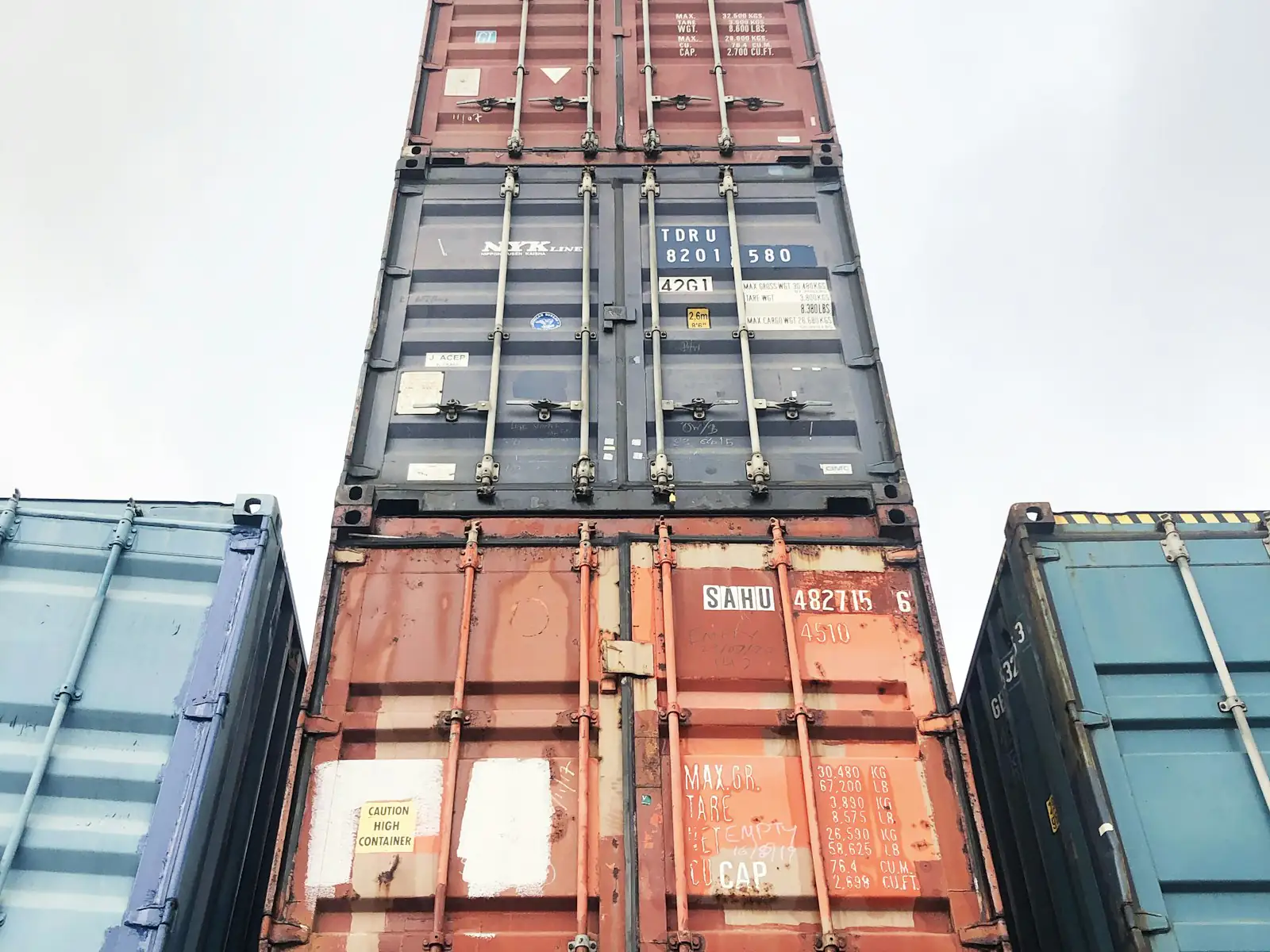 Stacked shipping containers at a customs and freight terminal