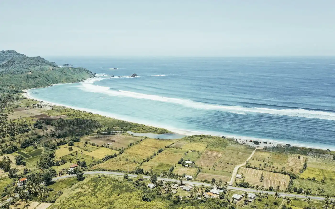 An aerial view of the Kuta to Mandalika coastline in southern Lombok, with serviced land behind the bay